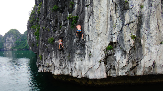 Climb rocks in Halong bay